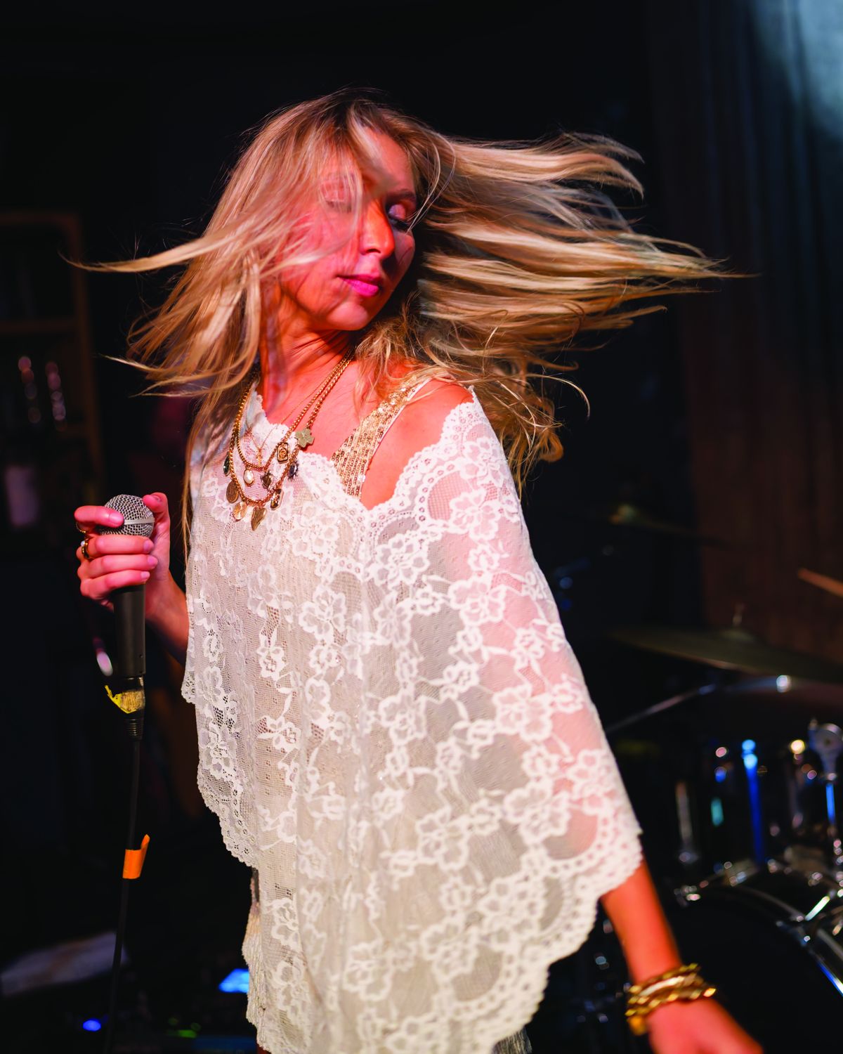 Sylvie mid-song, hair flying